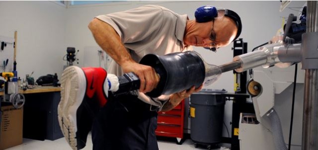 Technician works on prosthetic device