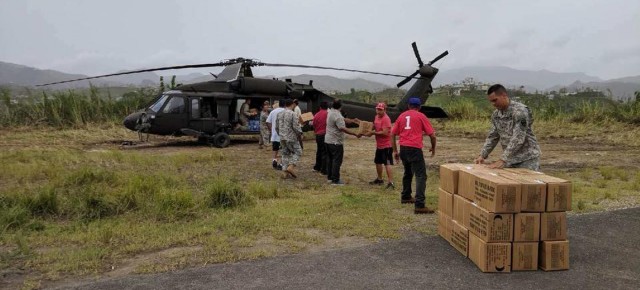 New York Army Guard aviators flew relief supplies and people to support Puerto Rico