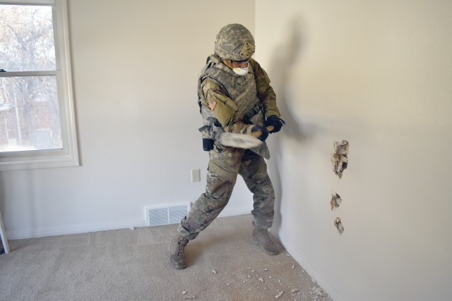 The 774th Explosive Ordnance Disposal Company at Fort Riley used vacant housing mark for demolition to train in non-standard entry.