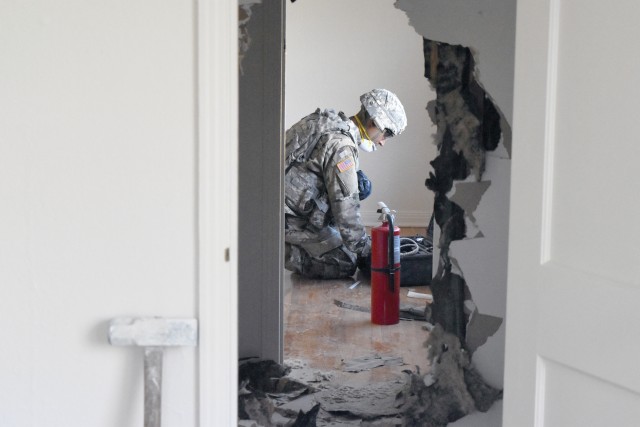 The 774th Explosive Ordnance Disposal Company at Fort Riley used vacant housing mark for demolition to train in non-standard entry.