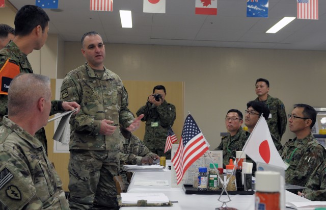 U.S. and Japanese Soldiers collaborate during Noncommissioned Officer Forum