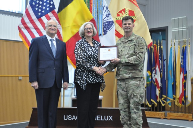 Col. Kurt Connell presents certificate to Cheryle Hess.