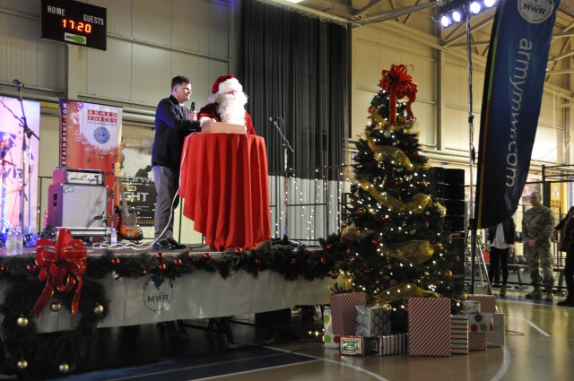 Col. Connell and Santa light the tree