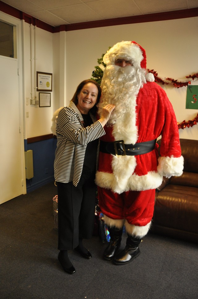 Yvette Castro hugs Santa at Open House