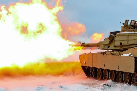 A round is fired from an M1A2 Main Battle Tank during a live-fire accuracy screening tests at the Presidential Range in Swietozow, Poland, Jan. 16, 2017.