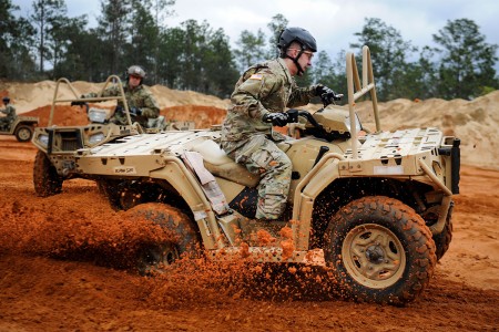 A Soldier with 10th Special Forces Group, executes a sharp turn in an all-terrain vehicle at Buck Pond in Navarre, Fla., March 14, 2017. An instructor with the 1st Special Operations Support Squadron Operational Support Joint Office trained Soldiers on riding techniques to qualify them for ATV usage in special operations missions.