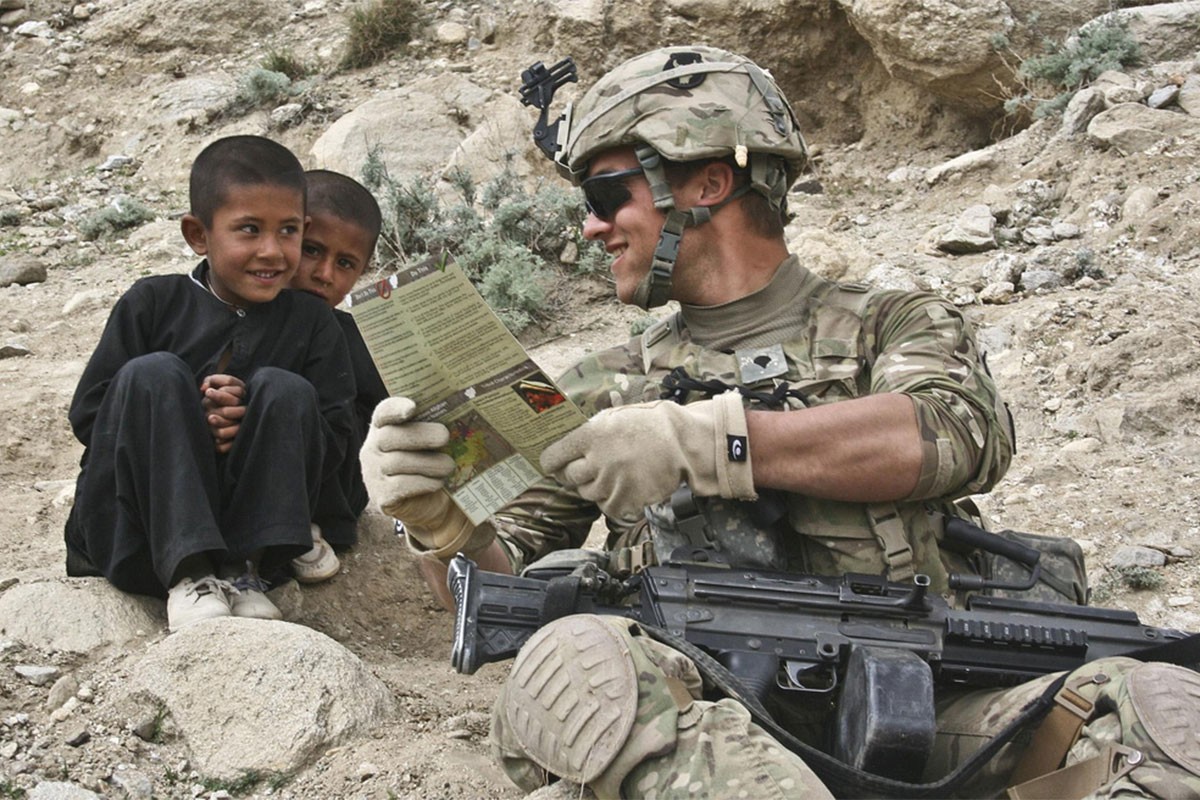 Reading to Afghan boys