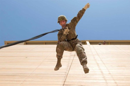 An Army Reserve Soldier with 316th Sustainment Command (Expeditionary), deployed to U.S. Central Command, rappels off of a tower during a professional development training at Camp Buehring, Kuwait, July 31, 2017.