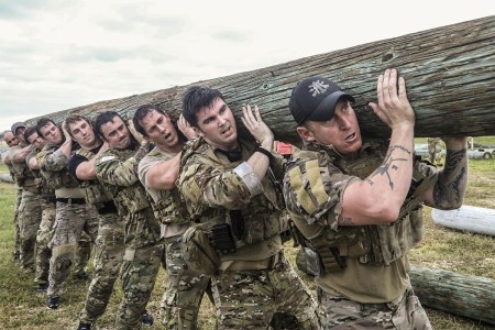 Soldiers assigned to the 1st Special Forces Group (Airborne), lifts a log during a battalion endurance event at Torii Station, Okinawa, Japan, Nov. 30, 2017. The event test Soldiers ability to assemble and disassemble the M249 light machine gun,...