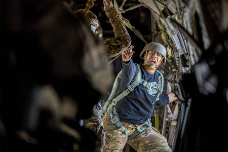 A jumpmaster relays commands during the 20th Annual Randy Oler Memorial Operation Toy Drop at Camp MacKall, N.C., Dec. 4, 2017. This year, eight countries participated including Colombia, Canada, Latvia, the Netherlands, Sweden, Italy, Germany and Poland. Operation Toy Drop, hosted by the U.S. Army Civil Affairs & Psychological Operations Command (Airborne) is the largest combined airborne operation conducted worldwide. The event allows Soldiers the opportunity to train on their military occupational specialty, maintain their airborne readiness and give back to the local community.