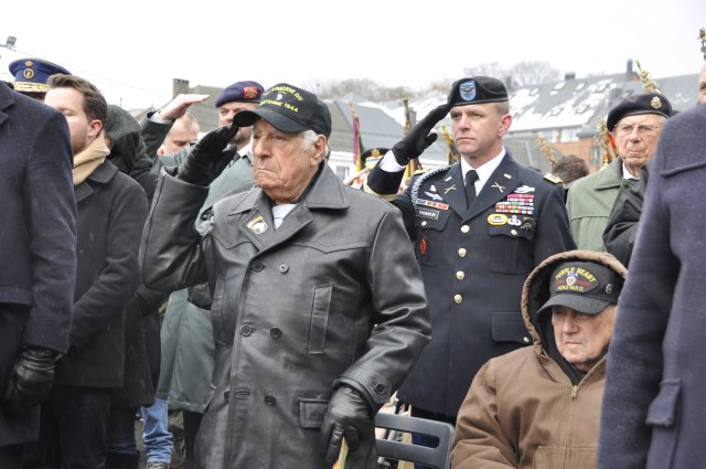Vince Speranza salutes during Battle of the Bulge ceremony