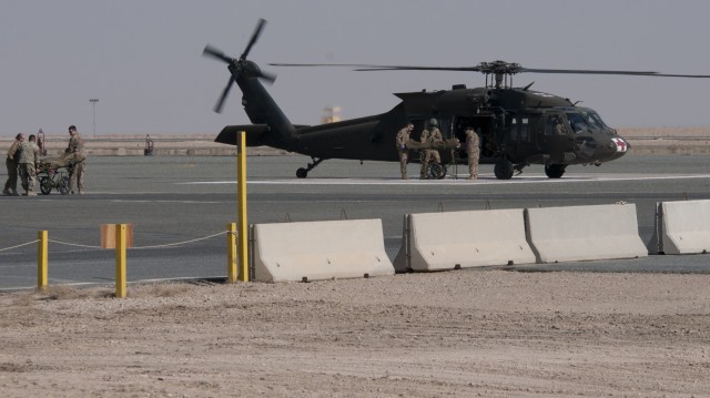 Medical personnel evacuate mock patient during training
