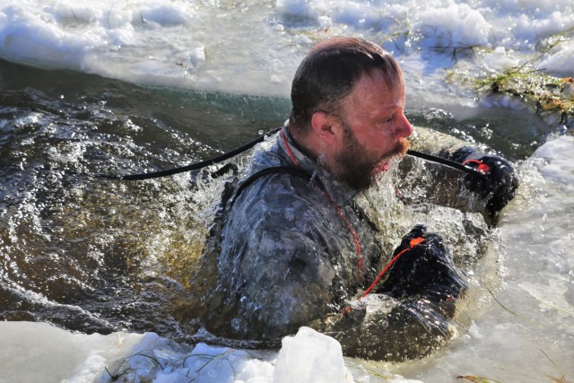 Cold-Weather Operations Course students battle icy conditions in cold-water immersion training at Fort McCoy