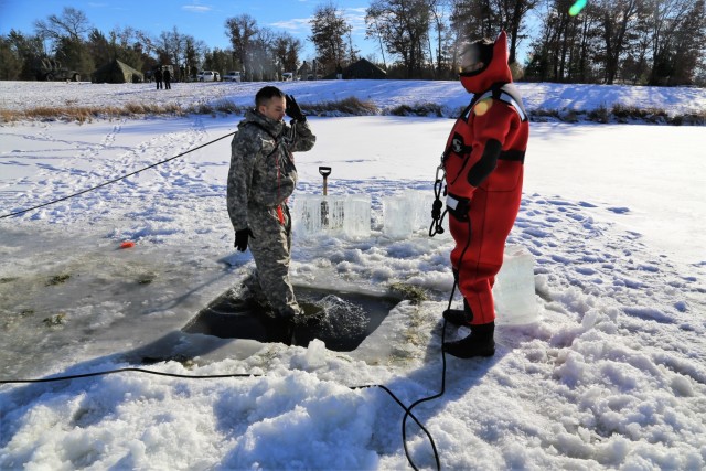 Cold-Weather Operations Course students battle icy conditions in cold-water immersion training at Fort McCoy