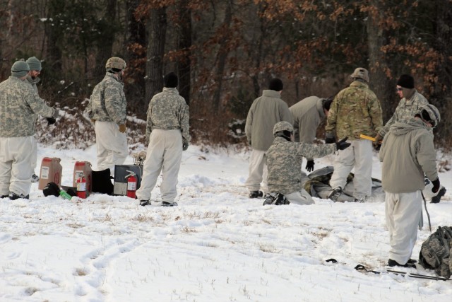Cold-Weather Operations Course Class 18-02 students build Arctic tents during training at Fort McCoy