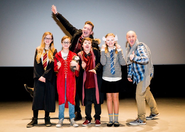 Cosplayers pose during a costume contest at Eight Nights of Harry Potter