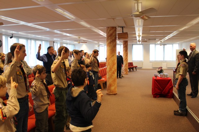 First Class Scout Elijah Morris leads the congregation