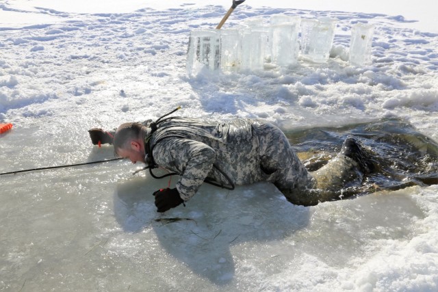 Service members battle icy conditions in cold-water immersion training at Fort McCoy