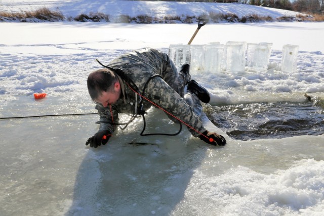 Service members battle icy conditions in cold-water immersion training at Fort McCoy