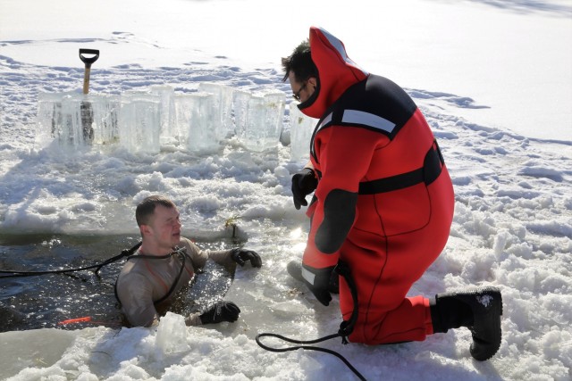 Service members battle icy conditions in cold-water immersion training at Fort McCoy