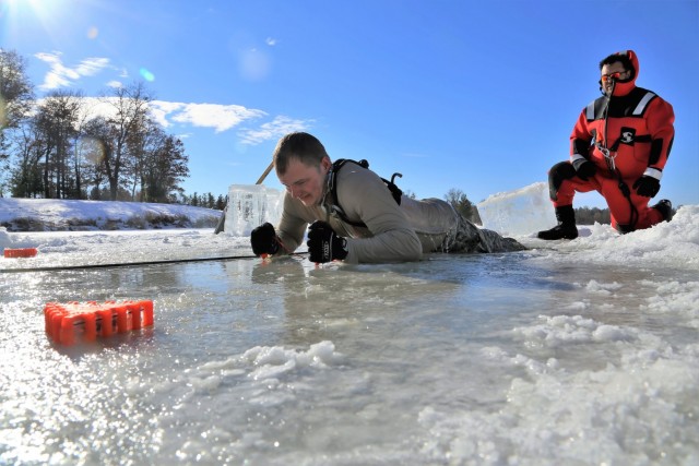 Service members battle icy conditions in cold-water immersion training at Fort McCoy