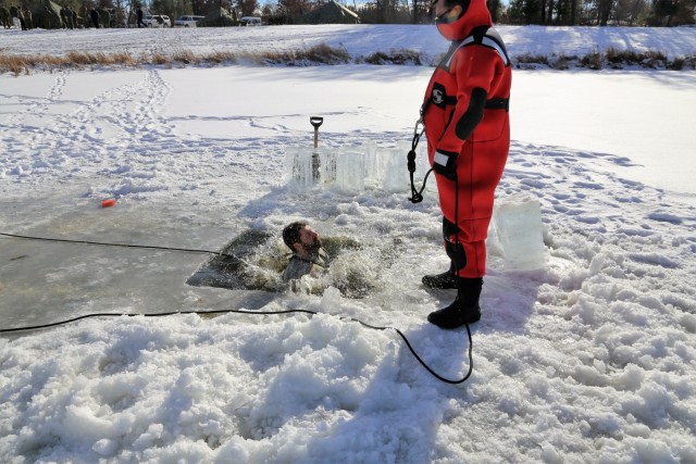 Service members battle icy conditions in cold-water immersion training at Fort McCoy