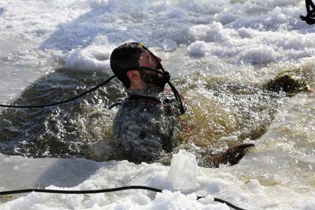 Service members battle icy conditions in cold-water immersion training at Fort McCoy