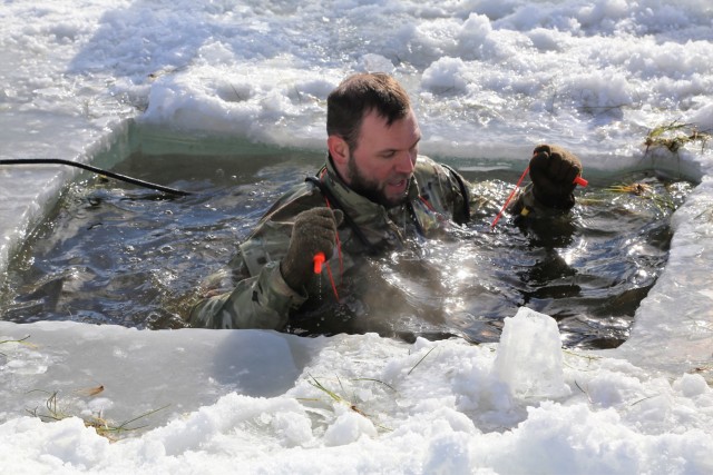 Service members battle icy conditions in cold-water immersion training at Fort McCoy