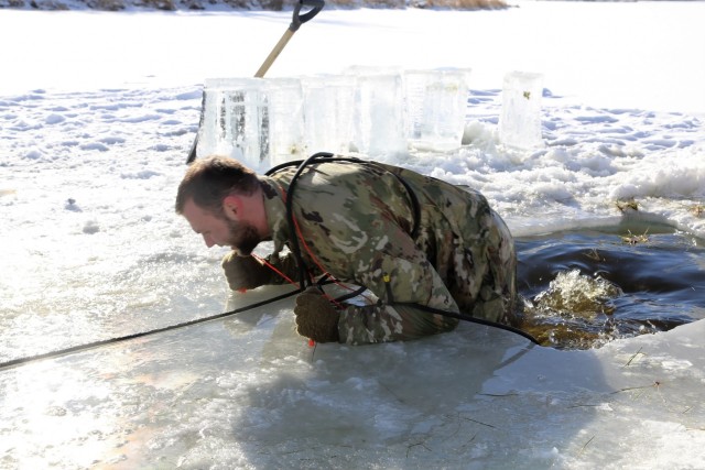 Service members battle icy conditions in cold-water immersion training at Fort McCoy