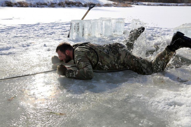 Service members battle icy conditions in cold-water immersion training at Fort McCoy