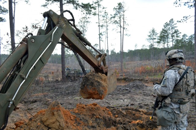 Engineers dig troop trenches for defense at JRTC