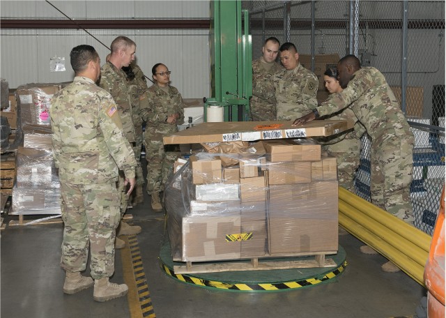 538th MCT Soldiers wrap palllets