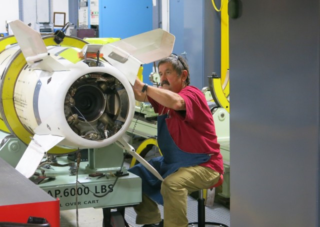 A Letterkenny Munitions Center technician inspects an Army Tactical Missile System.