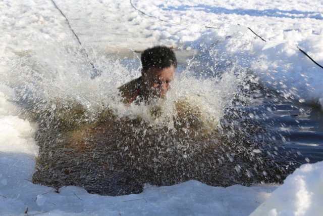 Cold-Weather Operations Course Class 18-04 students complete cold-water immersion training at Fort McCoy