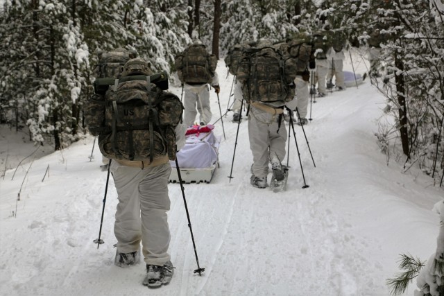 Cold-Weather Operations Course Class 18-06 students practice snowshoeing at Fort McCoy
