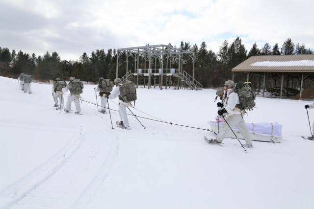 Cold-Weather Operations Course Class 18-06 students practice snowshoeing at Fort McCoy