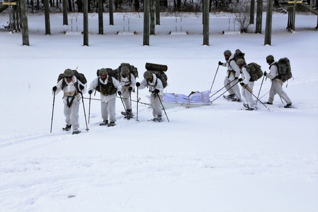 Cold-Weather Operations Course Class 18-06 students practice snowshoeing at Fort McCoy