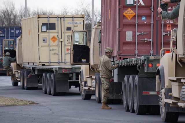A 432nd Transportation Company, U.S. Army Reserve - Puerto Rico Soldier prepares for Letterkenny Munitions Center to unload the shipping container from his flatbed in support of Operation Patriot Band