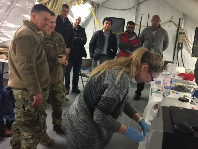 Col. Ryan Bailey briefed by Lt. Col. Kara Schmid on LATBI training exercise