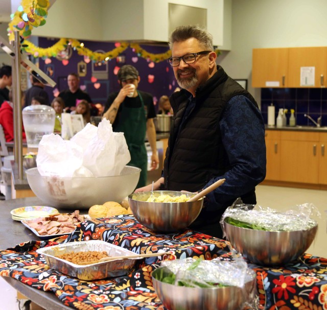 John Orme serves food at Spring Fest