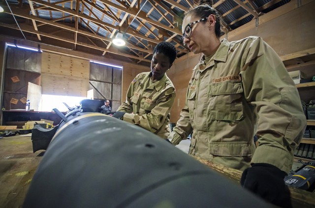 Ammunition quality assurance specialists work to ensure firepower readiness