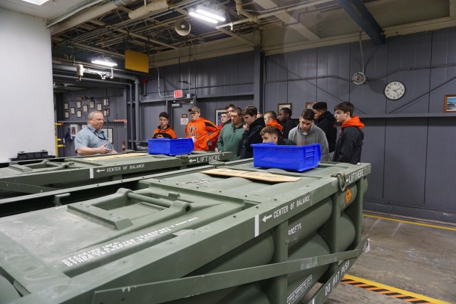 Ed Johnson, a Letterkenny Munitions Center supervisor, explains Multiple Launch Rocket System Family of Munitions maintenance processes to U.S. Air Force JROTC cadets from Cathedral Preparatory School