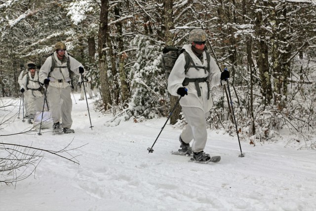 Cold-Weather Operations Course Class 18-06 students practice snowshoeing at Fort McCoy