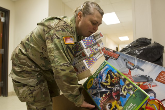 Fourth Cavalry Multi-Functional Training Brigade soldiers volunteer at Santa's Workshop