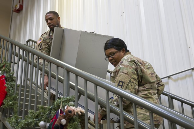 Fourth Cavalry Multi-Functional Training Brigade Soldiers volunteer at Santa's Workshop