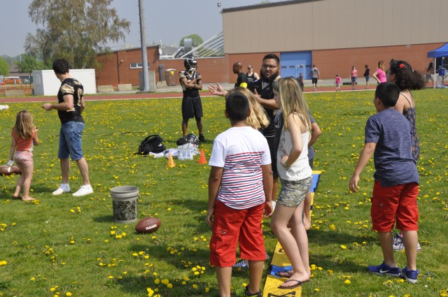 Nick Granado teaches football to kids