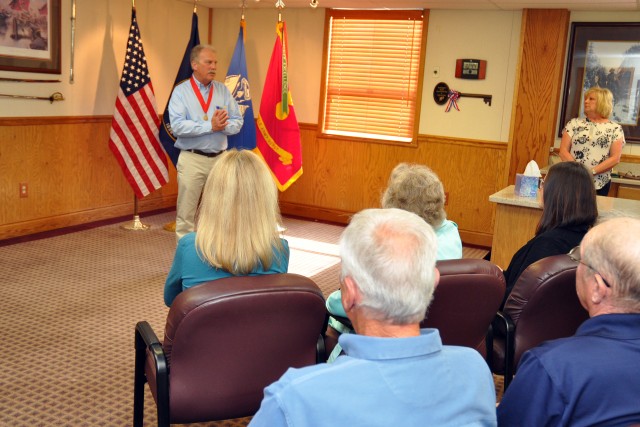 Keith Siniscalchi, civilian deputy to the commander, Tooele Army Depot, speaks to well-wishers during his retirement ceremony