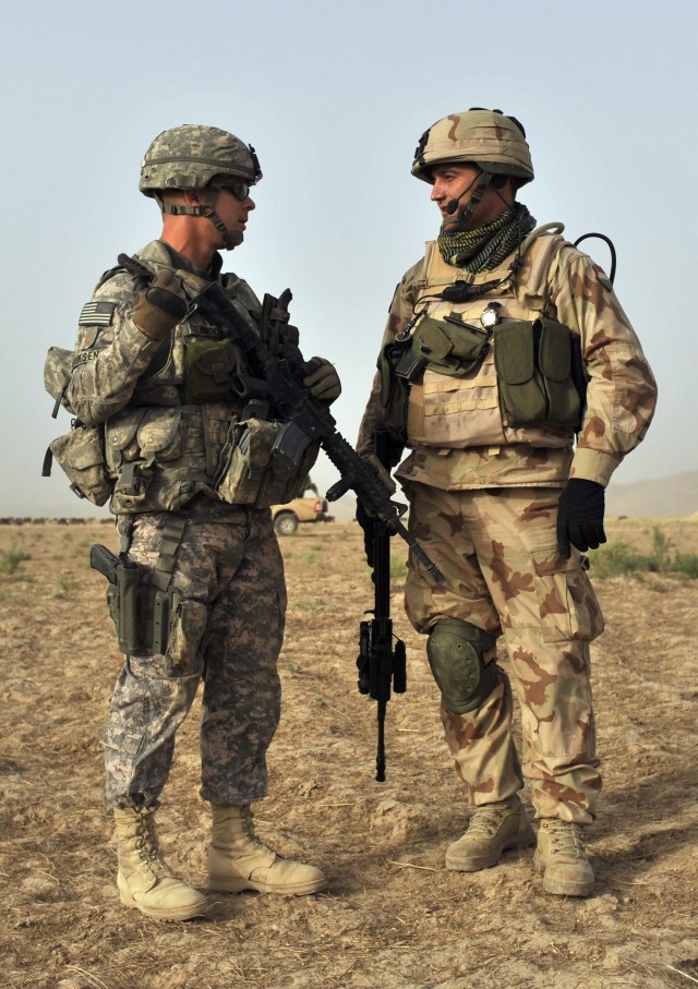 Maj. James Eriksen talks with a Hungarian army counterpart