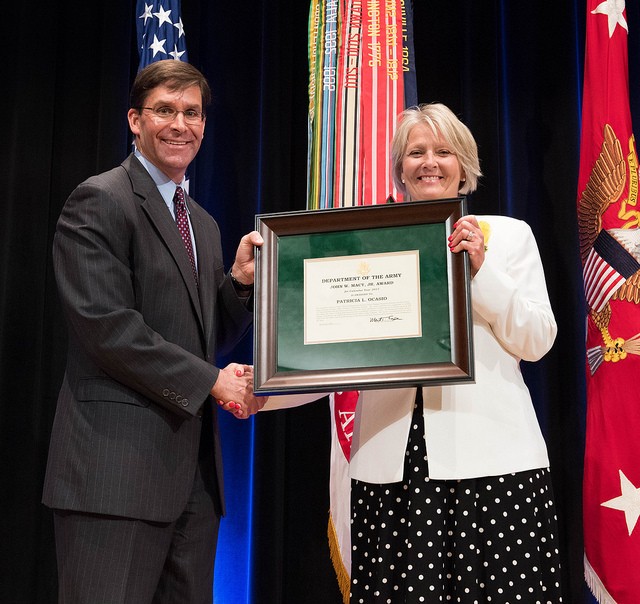 Dr. Mark T. Esper awards Ms. Patricia L. Ocasio with John W. Macy, Jr. Award