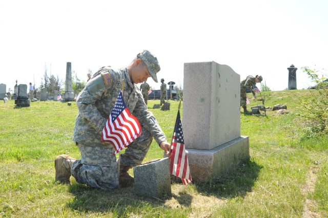 10th Mountain Division (LI) Soldiers honor Memorial Day tradition with flag-planting at cemeteries